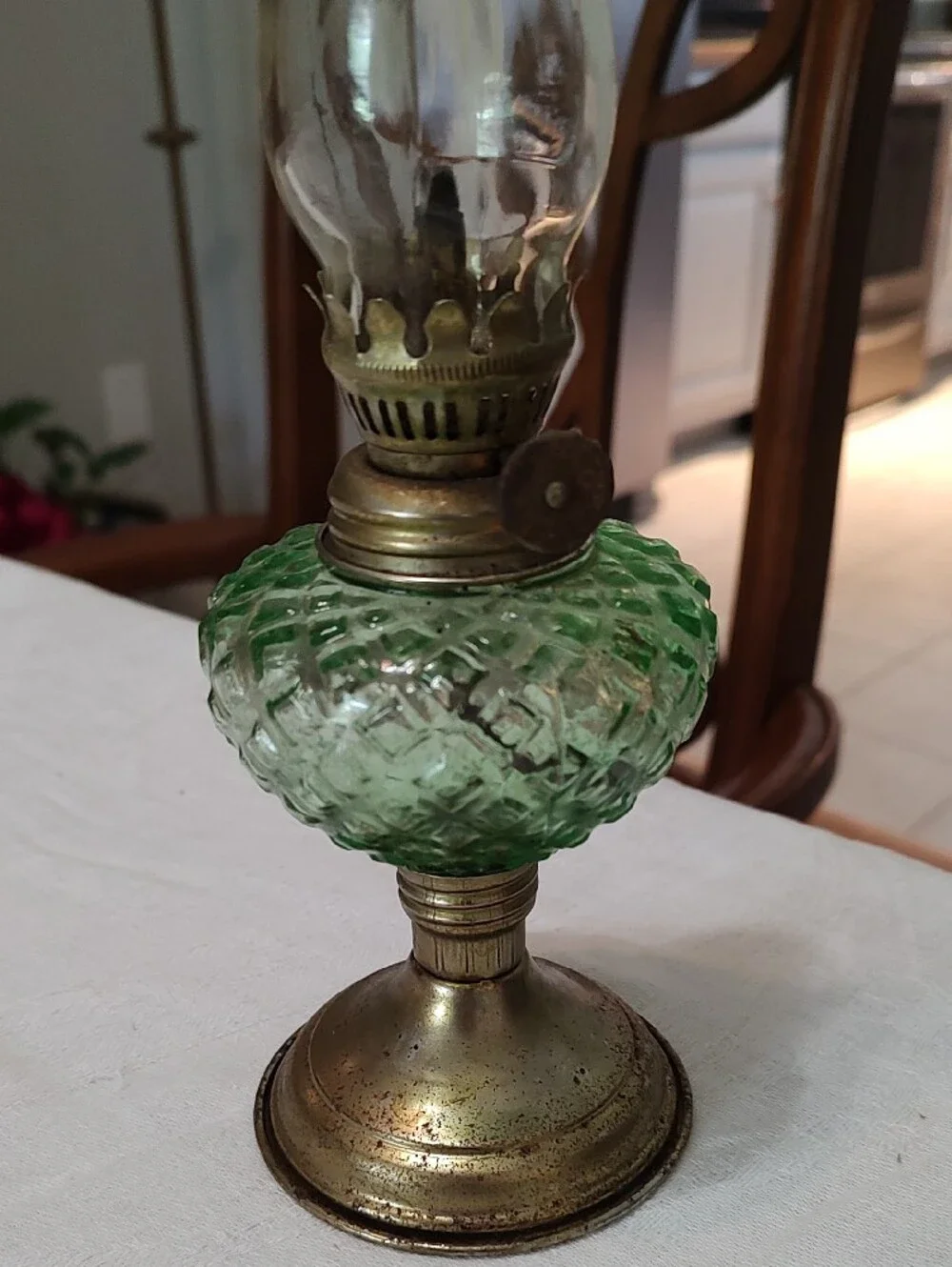 Vintage Small Oil Lamp With Clear Globe And Green Center With Brass Bass.